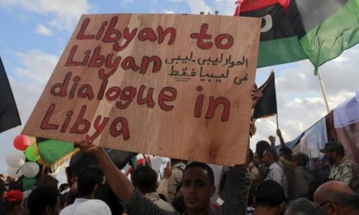 A man holds a sign during a protest in Benghazi, Libya, October 2015. © Reuters/Esam Omran Al-Fetori A man holds a sign during a protest in Benghazi, Libya, October 2015. © Reuters/Esam Omran Al-Fetori