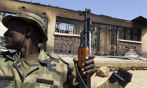A soldier sits in a truck during a military patrol in Nigeria's central city of Jos. © Reuters - Akintunde Akinleye A soldier sits in a truck during a military patrol in Nigeria's central city of Jos. © Reuters - Akintunde Akinleye